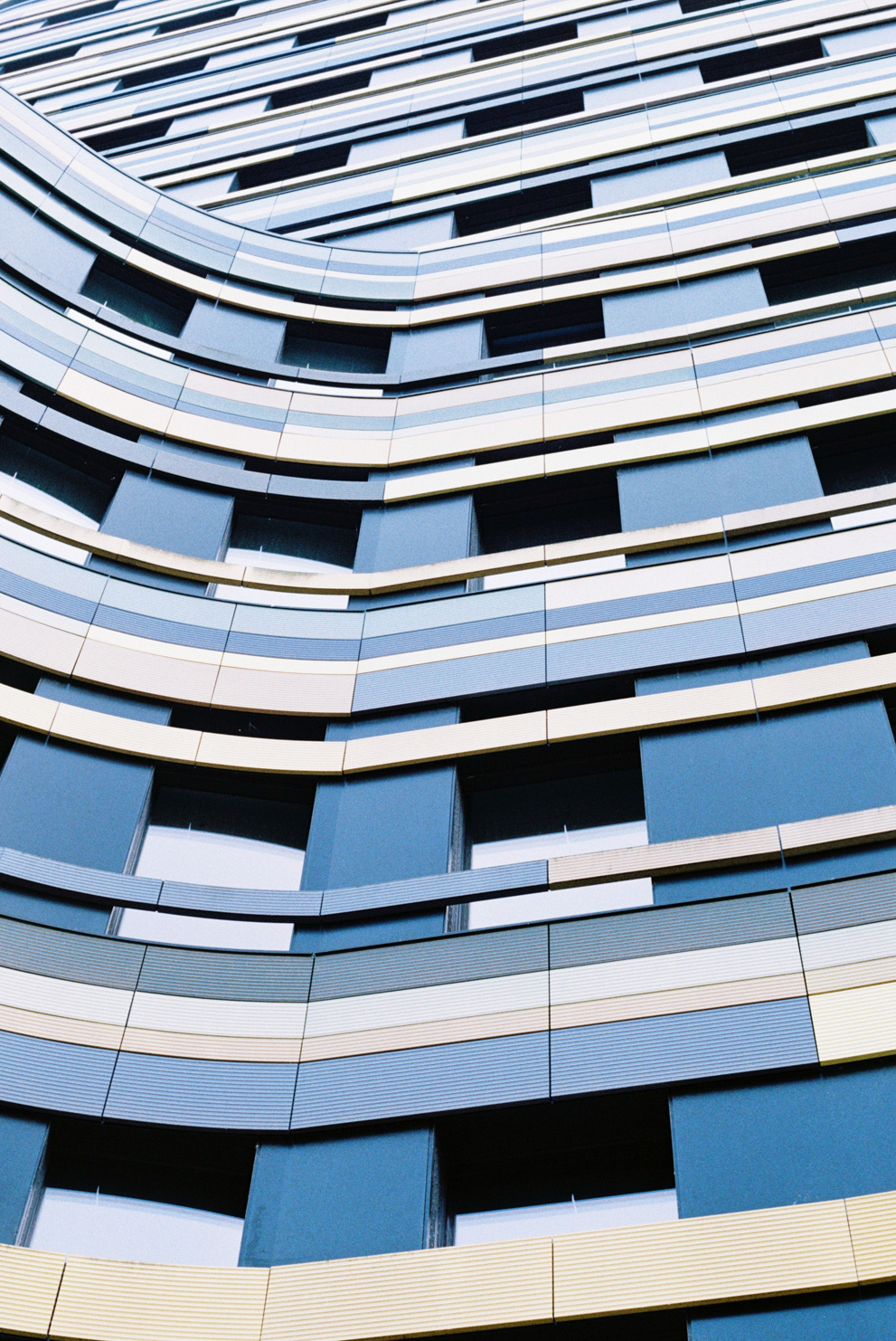 The façade of a modern Hamburg building. Shot on Kodak Gold 200.